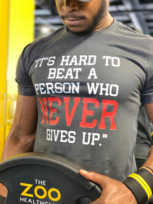 Its Hard To Beat A person Who Never Give Up T-shirts